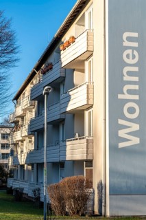 Residential buildings, rented flat, facade with the inscription, Wohnen, on Adolf-Schmidt-Strasse,