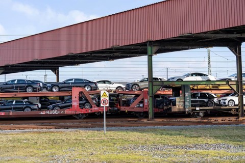 Car train, goods train on its way to the car terminal in Bremerhaven seaport, new German cars for