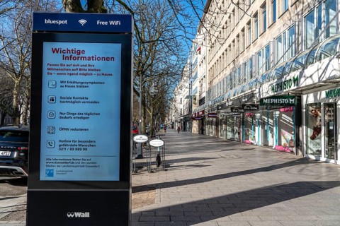 Advertising displays, on Königsallee, Kö, give advice on correct behaviour, empty city centre,