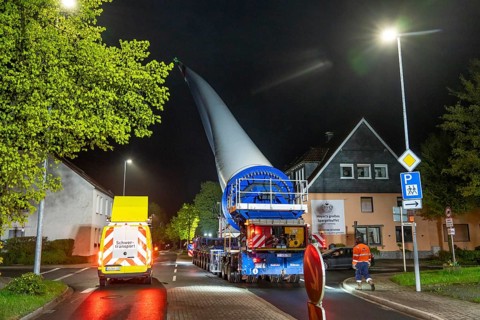 Transport of a 68 metre long, 22 tonne blade of a wind turbine, here in Breckerfeld-Waldbauer, with