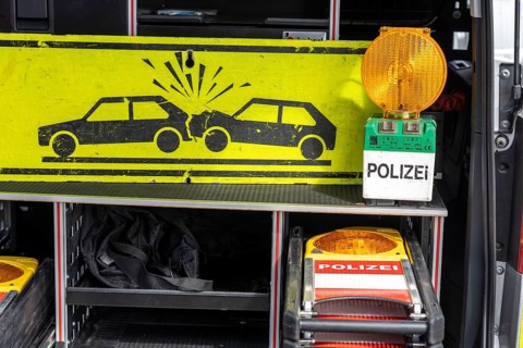 Motorway police patrol cars, warning signs, beacons, signal lamps