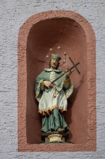 Figure of St Nepomuk in a niche in a residential building, Rottweil, Baden-Württemberg, Germany,