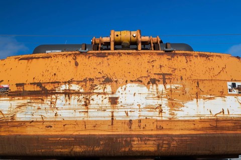 Rusted back end of yellow painted backhoe excavator, Quebec, Canada, North America