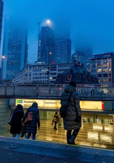 Rainy weather, freezing rain, entrance to Hauptwache underground station, high-rise skyline in
