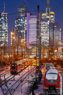 Railway tracks in front of the main railway station in Frankfurt am Main, skyline of skyscrapers in