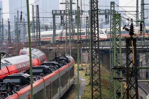 Railway tracks with regional and long-distance trains, ICE, after freezing rain, in front of