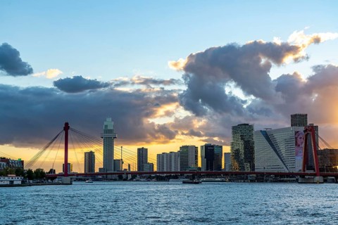 The skyline of Rotterdam, with the Erasmus Bridge over the Nieuwe Maas, district, Netherlands