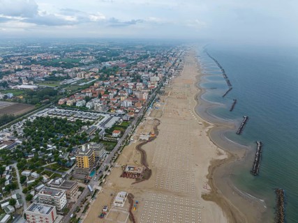 Bathing beach in Rimini. Bathing beach on the Adriatic in bad weather. All deckchairs are free.