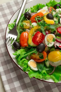 Vegetable salad, with quail eggs and olives, fresh, close-up, no people