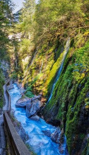 A narrow gorge with lush moss, waterfalls and a peaceful forest path, Wimbachklamm