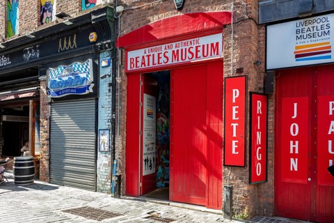 Entrance to the Beatles Museum with striking red sign, Liverpool