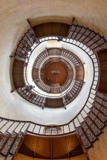 Spiral view of a staircase with ornate banisters and an impressive architectural structure, Rügen,