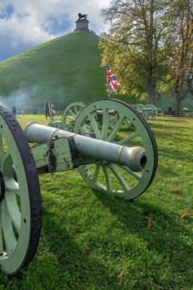 Replica of French Napoleonic war 6-pound cannons and Lion's Mound at the Domain of the Waterloo