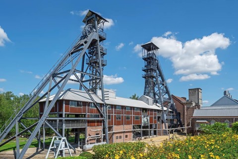 Two colliery headframes and coal mine buildings at Le Bois du Cazier, coal mining museum at