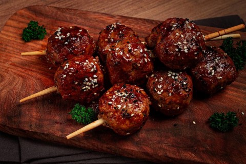 Tsukune, Japanese meatballs, minced chicken, fried on a skewer, with yakitori sauce, homemade, no