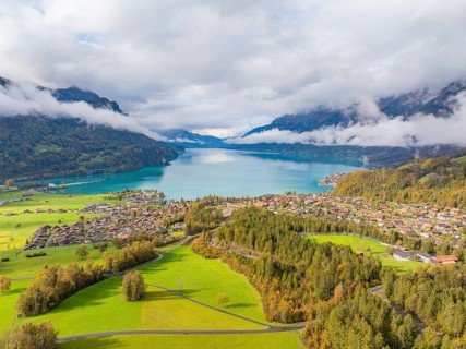 Aerial view of a village on a lake surrounded by a mountain landscape, Lake Brienz, Switzerland,