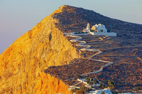 View of Panagia Kimissis church built on a cliff above the sea, Chora, Folegandros Island, Cyclades
