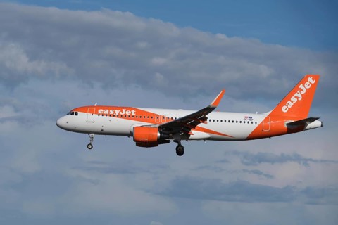 Lisbon, Portugal - September 2, 2023: easyJet Airbus A320-214 passenger plane ascends to landing in
