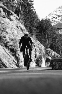 Road bike rider in spring between Lechtal and Tannheimer Tal in front of picturesque scenery of the