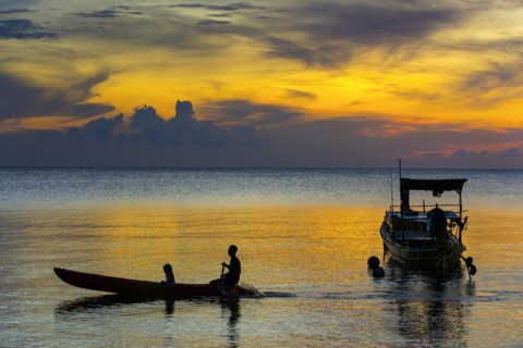 Canoe in the sunset, boat, sun, evening mood, cloudy sky, colourful, orange, wooden boat, sea,