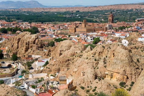 Traditional town embedded in a mountainous summer landscape under a blue sky, Alcazaba, Cathedral,