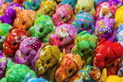 Small colourful elephants as stuffed animals, souvenir, souvenir, stuffed animal, child, childhood,