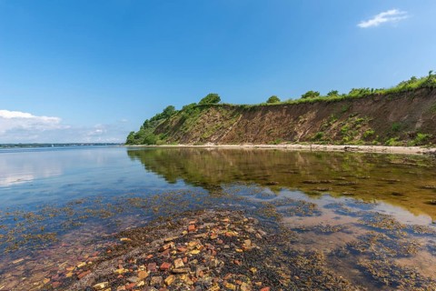 Nature reserve Holnis peninsula on the Flensburg Fjord, nature reserve, water reflection, blue sky,