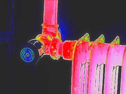 Radiator with thermostat. Thermal image or thermography, symbol photo, interpolated. Germany
