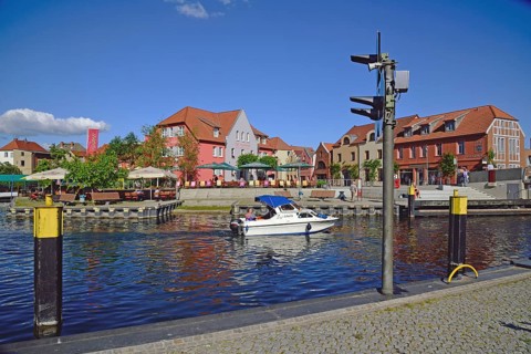 Europe, Germany, Mecklenburg-Western Pomerania, island town of Malchow, Lake Malchow, at the swing