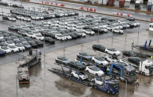 Tesla Y new cars are loaded onto car transporters at the Tesla Giga Factory, Grünheide, 25.09.2024