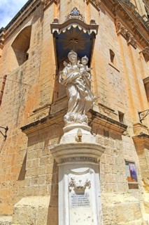 Madonna and baby Jesus Christ statue, Carmelite church and priory in medieval city of Mdina, Malta,