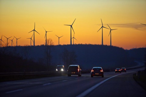Wind turbines at sunrise with cars on the A 44 motorway, Büren, Paderborn plateau, North