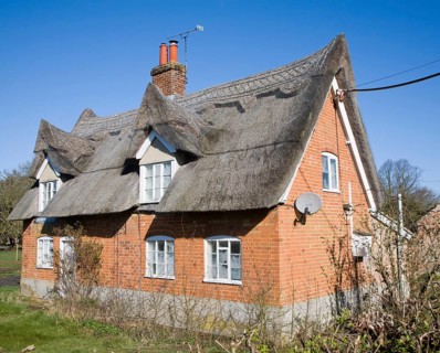 Traditional red brick thatched cottage, Sutton, Suffolk, England, United Kingdom, Europe