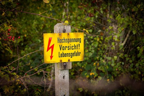 Autumn in the Gebergrund near Rippien. Caution high voltage sign. Rippien, Saxony, Germany, Europe