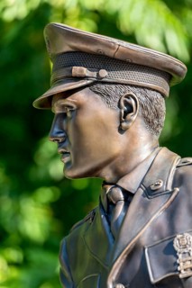 Bronze statue, monument to rock singer Elvis Presley, King of Rock 'n' Roll in uniform of the 3rd