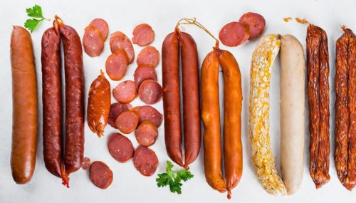 Food, meat products, various smoked sausages on a white surface AI generated, AI generated