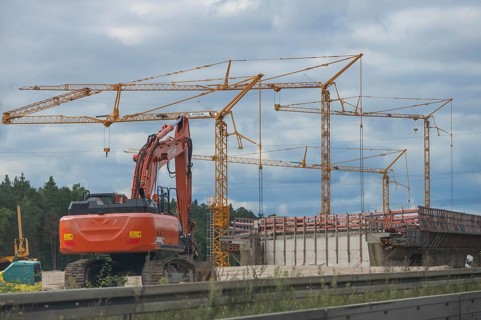Construction cranes and construction machinery on the A6 Nuremberg-Heilbronn motorway, Bavaria,