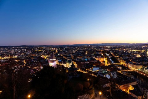 Evening mood, view from the Schlossberg to the clock tower and the historic city centre, Graz,