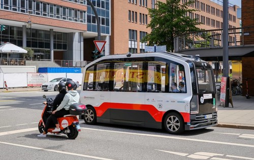 Hamburg, Germany - Autonomous elevated railway electric bus and an Emmy electric scooter in