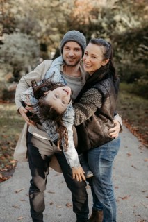 Parents with daughter, family photo