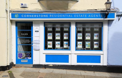 Cornerstone estate agent shop window Market Hill, Woodbridge, Suffolk, England, UK