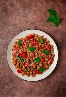 Tuscan pasta with smoked paprika and basil, parmesan cheese, Italian traditional cuisine