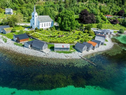 Aerial view of beach and church in Selje, wooden boat sheds, Stad, Vestland, Norway, Europe
