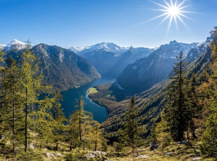 Panoramic view of the Königssee from the Archenkanzel viewpoint, autumnal forest and snow-capped