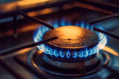 Close up of kitchen gas oven with burning flames. Generative Ai, AI generated