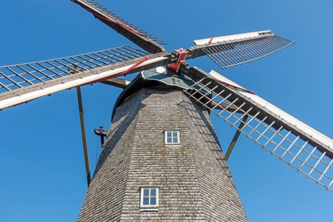 Lattice work of sails from 19th century wooden octagonal windmill Schulen at open air museum