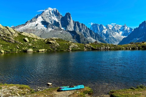 Bivouac site on the shore of the Lacs des Chéserys mountain lake in the Aiguilles Rouges nature