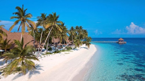 Bird's eye view of sandy beach Maldives beach beach and narrow lagoon of Maldives island with under