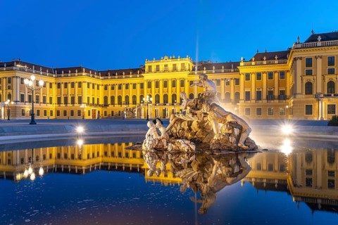 Fountain in the courtyard of honour at Schönbrunn Palace at dusk, UNESCO World Heritage Site in