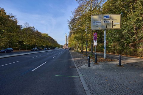 Signposts to Schöneberg, Charlottenburg and Wedding, Victory Column and autumnal trees in Berlin,